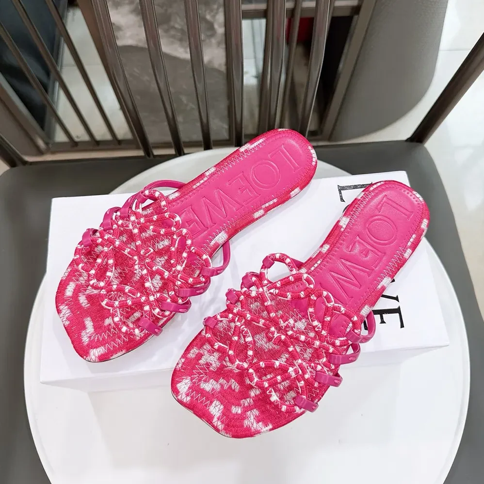 Loewe Petal Anagram Slide in Embroidered Canvas for Women in Orchid Loewe Petal Anagram Slide in Embroidered Canvas for Women in Orchid