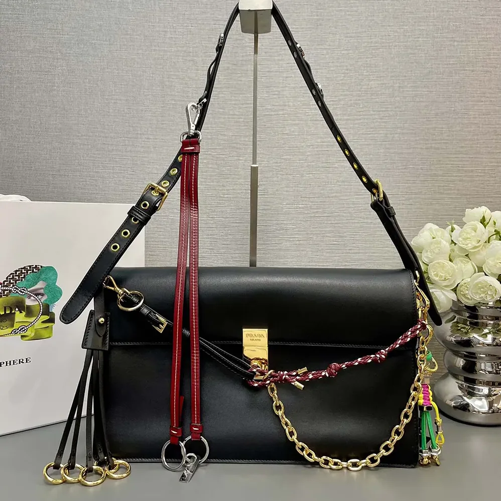 Prada Soft Sound Large Leather Shoulder Bag with Charms for Women in Black