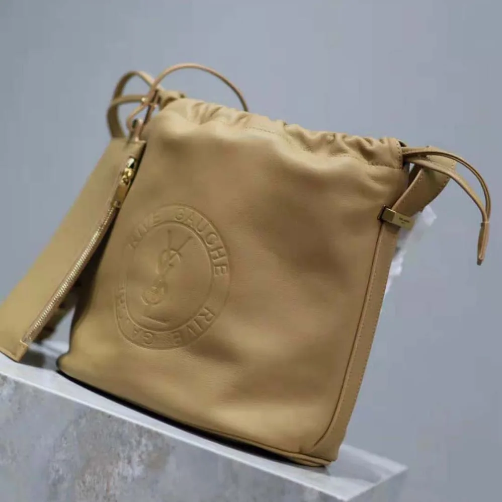 Saint Laurent YSL Rive Gauche Laced Bucket Bag in Smooth Leather for Men in Brown