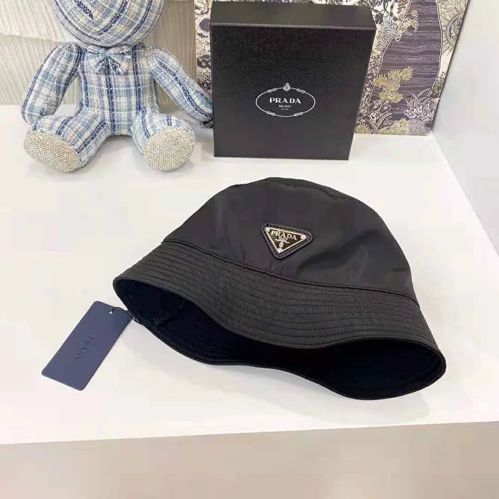 Prada Nylon Bucket Hat Decorated with the Triangle Logo for Women in Black Prada Nylon Bucket Hat Decorated with the Triangle Logo for Women in Black