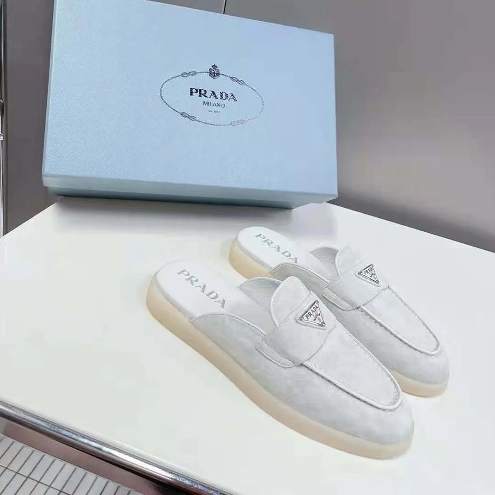 Prada Suede Leather Sabots with Enameled Metal Triangle Logo for Unisex in White