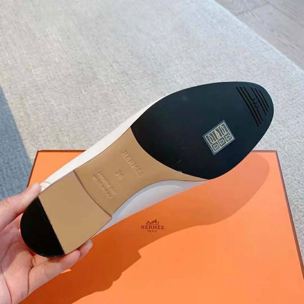 Hermes Paris Loafer in Calfskin with Palladium Plated Signature “H” Detail for Women in White Hermes Paris Loafer in Calfskin with Palladium Plated Signature “H” Detail for Women in White