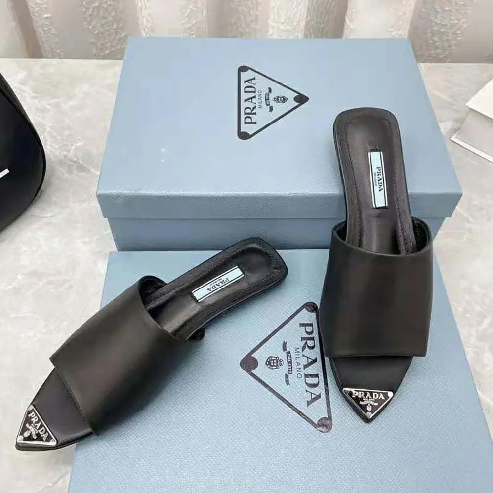 Prada Brushed Leather Slides with a Modernist Line Feature an Unexpected for Women