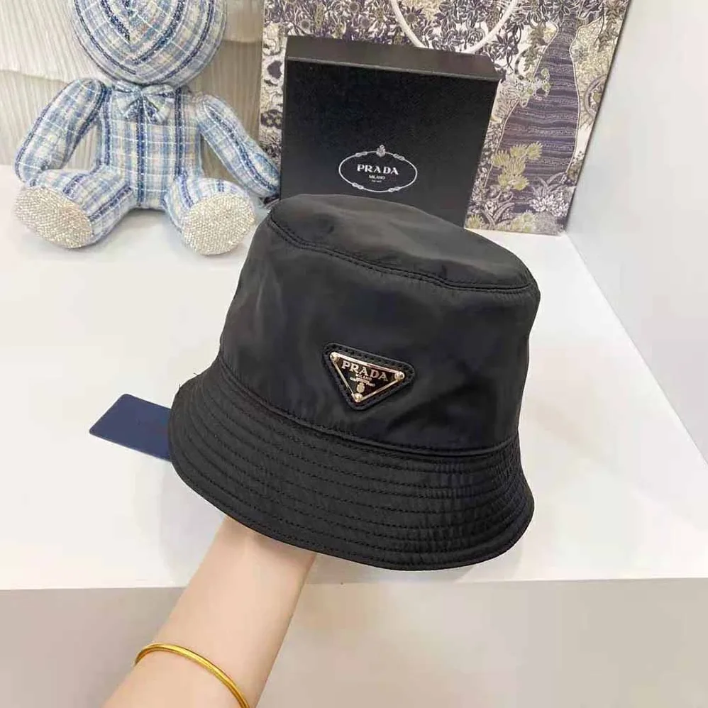 Prada Nylon Bucket Hat Decorated with the Triangle Logo for Women in Black Prada Nylon Bucket Hat Decorated with the Triangle Logo for Women in Black