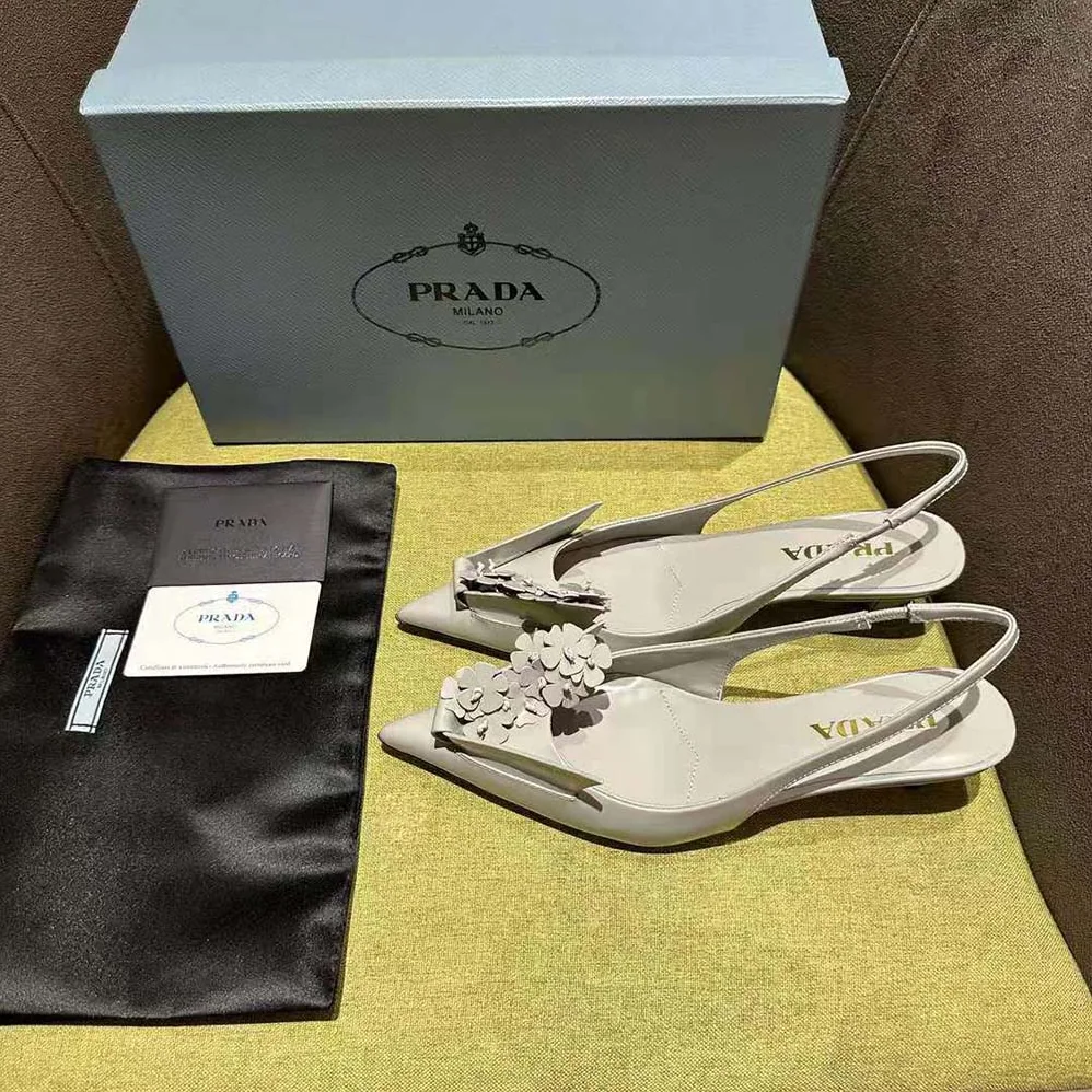 Prada Brushed Leather Slingback Pumps with Floral Appliques for Women in Gray Prada Brushed Leather Slingback Pumps with Floral Appliques for Women in Gray