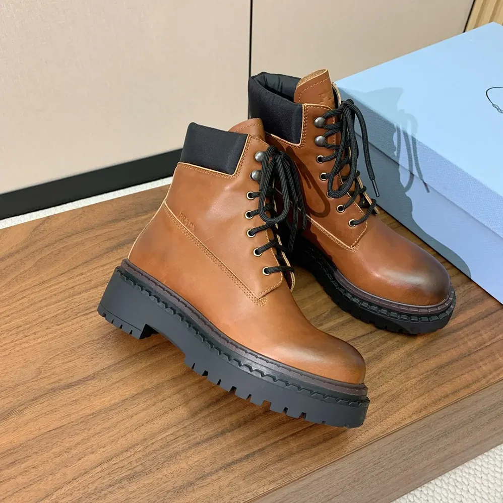 Prada Leather and Re-Nylon booties for Unisex in Ebony