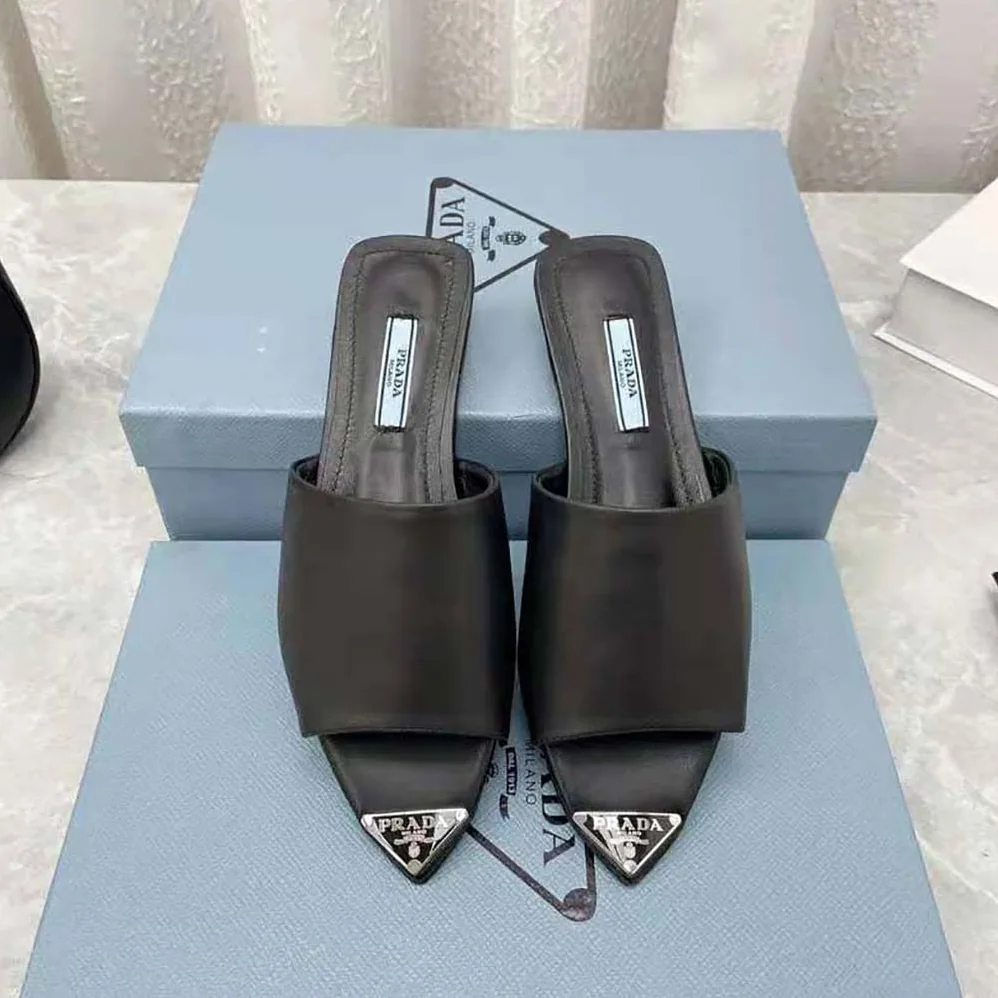 Prada Brushed Leather Slides with a Modernist Line Feature an Unexpected for Women