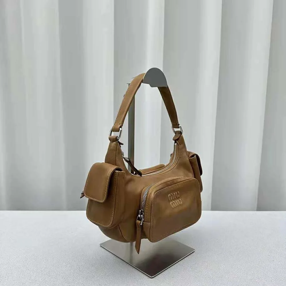 Miu Miu Pocket Nappa Leather Bag with Embossed Lettering Logo for Women in Brown Miu Miu Pocket Nappa Leather Bag with Embossed Lettering Logo for Women in Brown