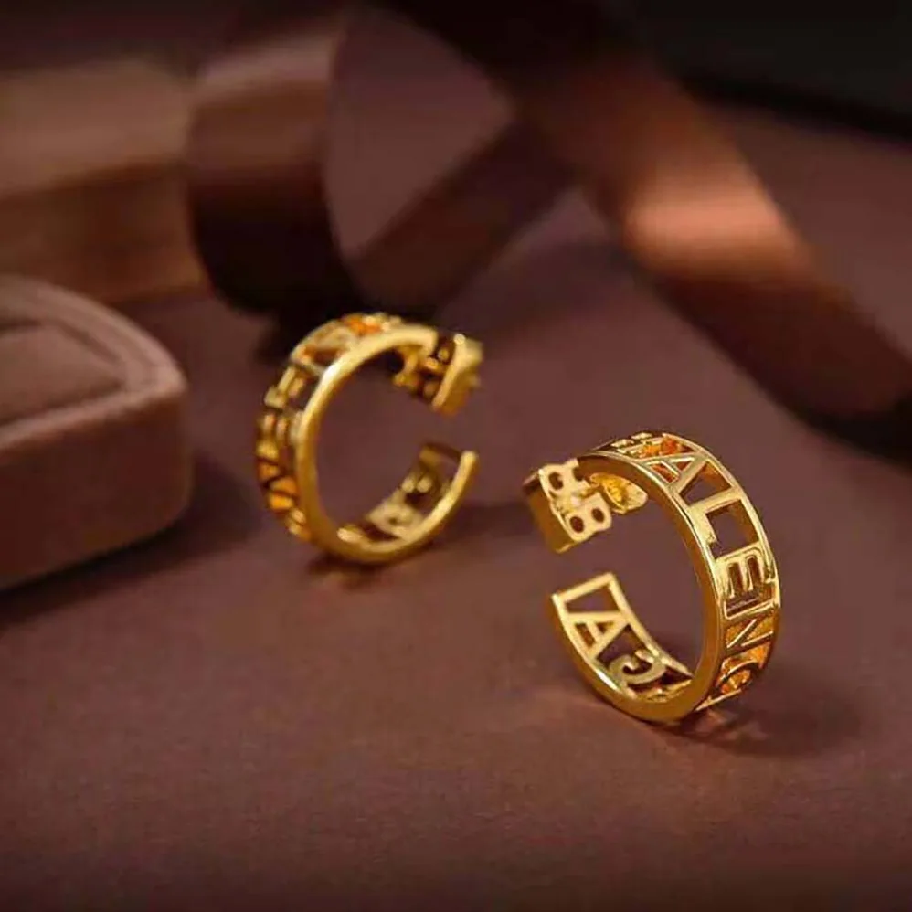 Balenciaga Logo Earrings in Gold Brass for Women