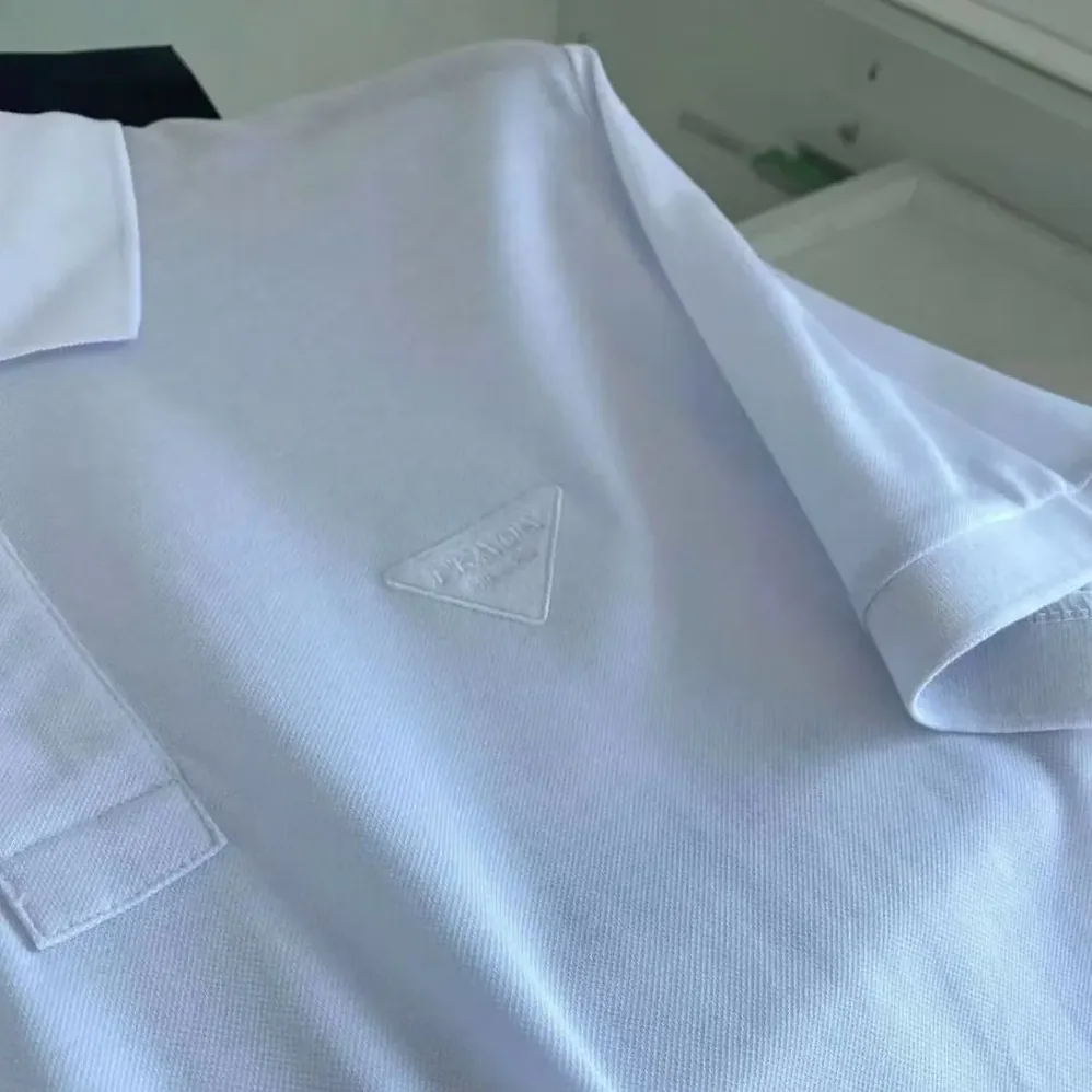 Prada Piqué Polo Shirt with Iconic Triangle Logo for Men Prada Piqué Polo Shirt with Iconic Triangle Logo for Men