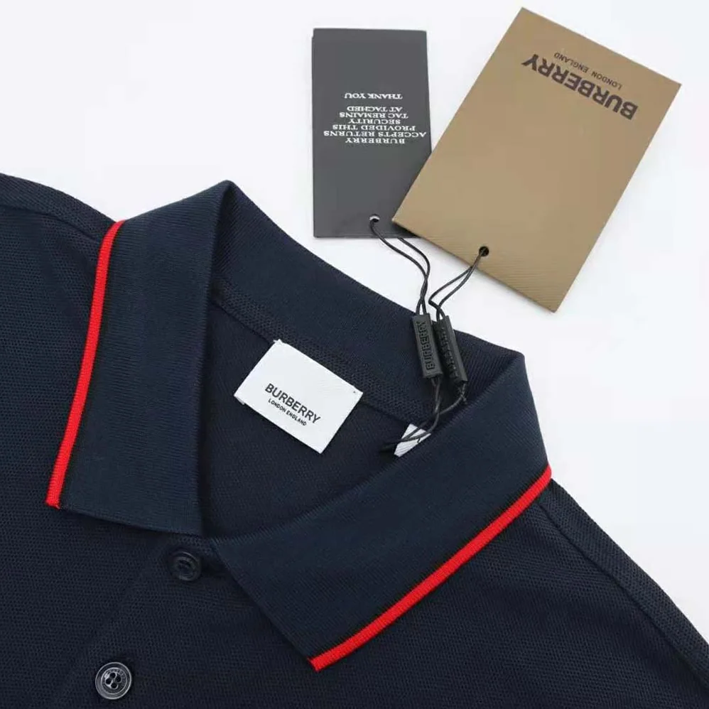 Burberry Icon Stripe Placket Cotton Piqué Polo Shirt for Men in Navy Burberry Icon Stripe Placket Cotton Piqué Polo Shirt for Men in Navy