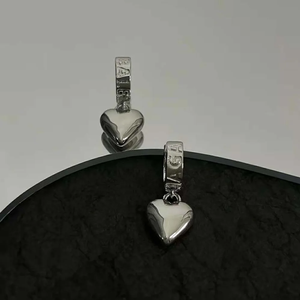 Balenciaga Sharp Heart Earrings in Silver for Women