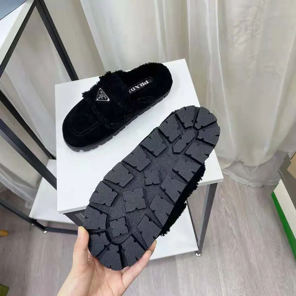 Prada Shearling Slippers Enameled Metal Triangle Logo for Women in Black