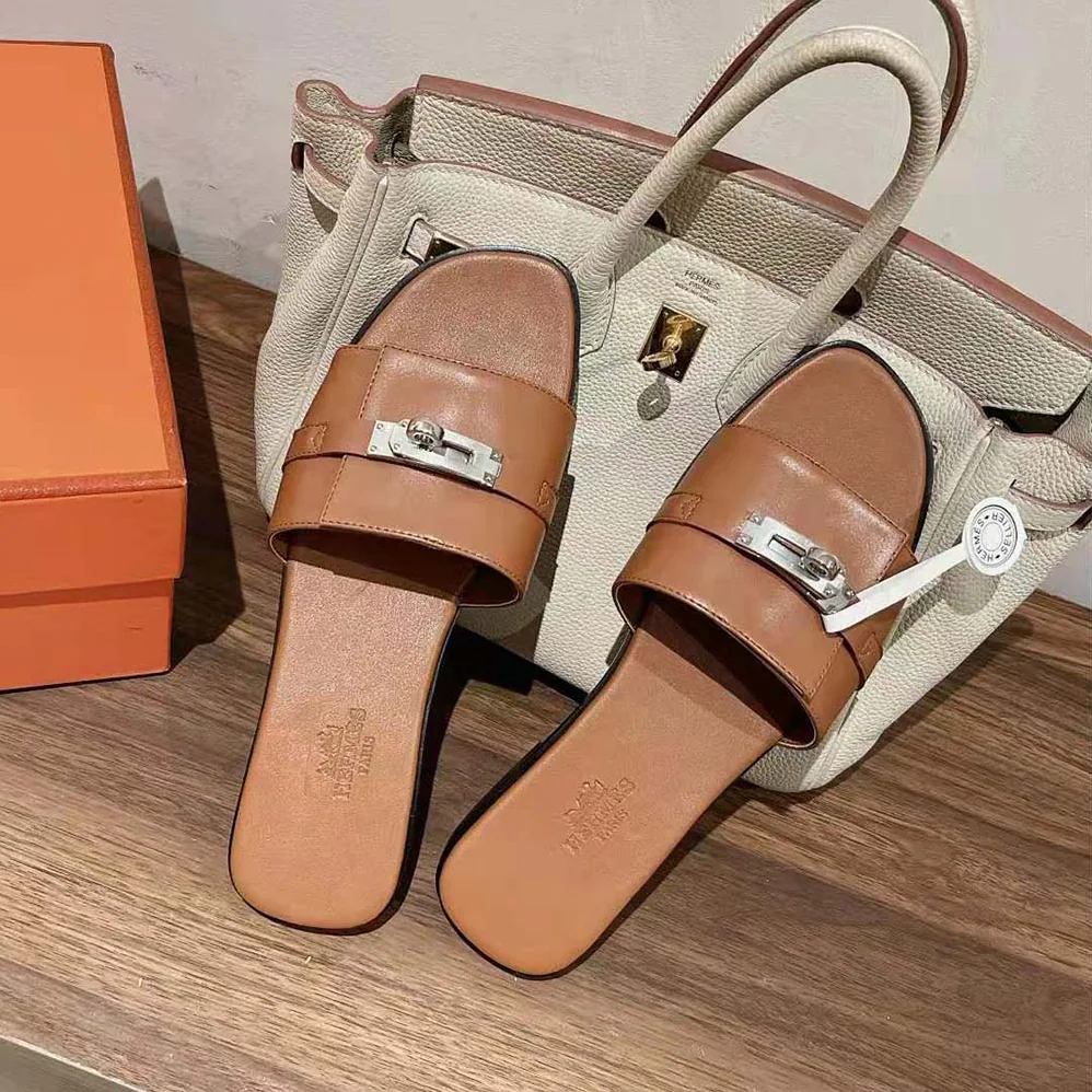 Hermes Giulia Sandal in Calfskin with Iconic Palladium-Plated Kelly Buckle for Women in Brown Hermes Giulia Sandal in Calfskin with Iconic Palladium-Plated Kelly Buckle for Women in Brown