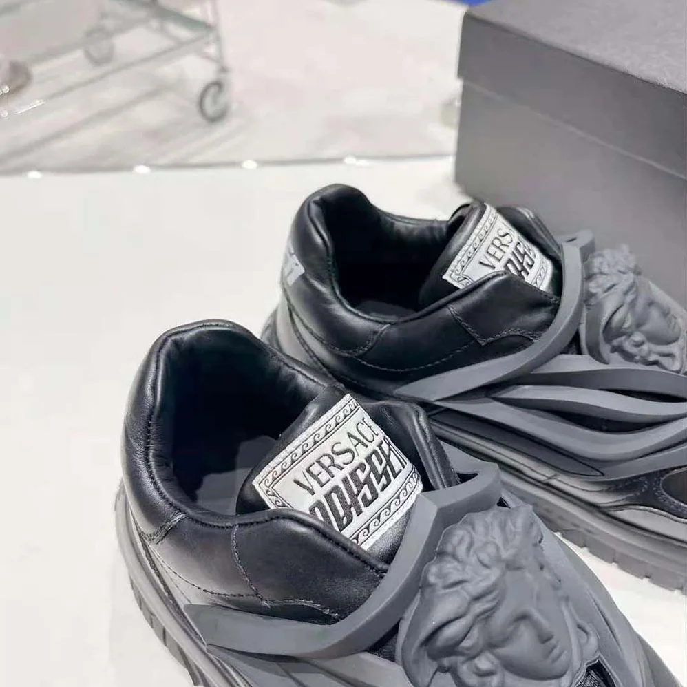 Versace Odissea Sneakers are Set on Rubber Soles with Perforated Toe Caps for Unisex in Black Versace Odissea Sneakers are Set on Rubber Soles with Perforated Toe Caps for Unisex in Black