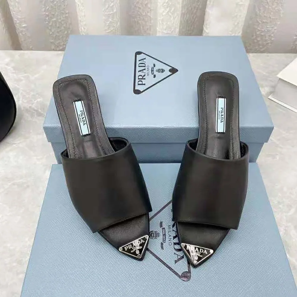 Prada Brushed Leather Slides with a Modernist Line Feature an Unexpected for Women