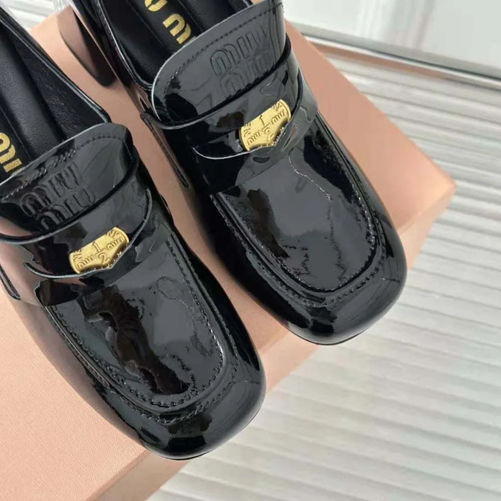 Miu Miu Patent Leather Loafers with Embossed Logo on the Tongue for Women in Black Miu Miu Patent Leather Loafers with Embossed Logo on the Tongue for Women in Black