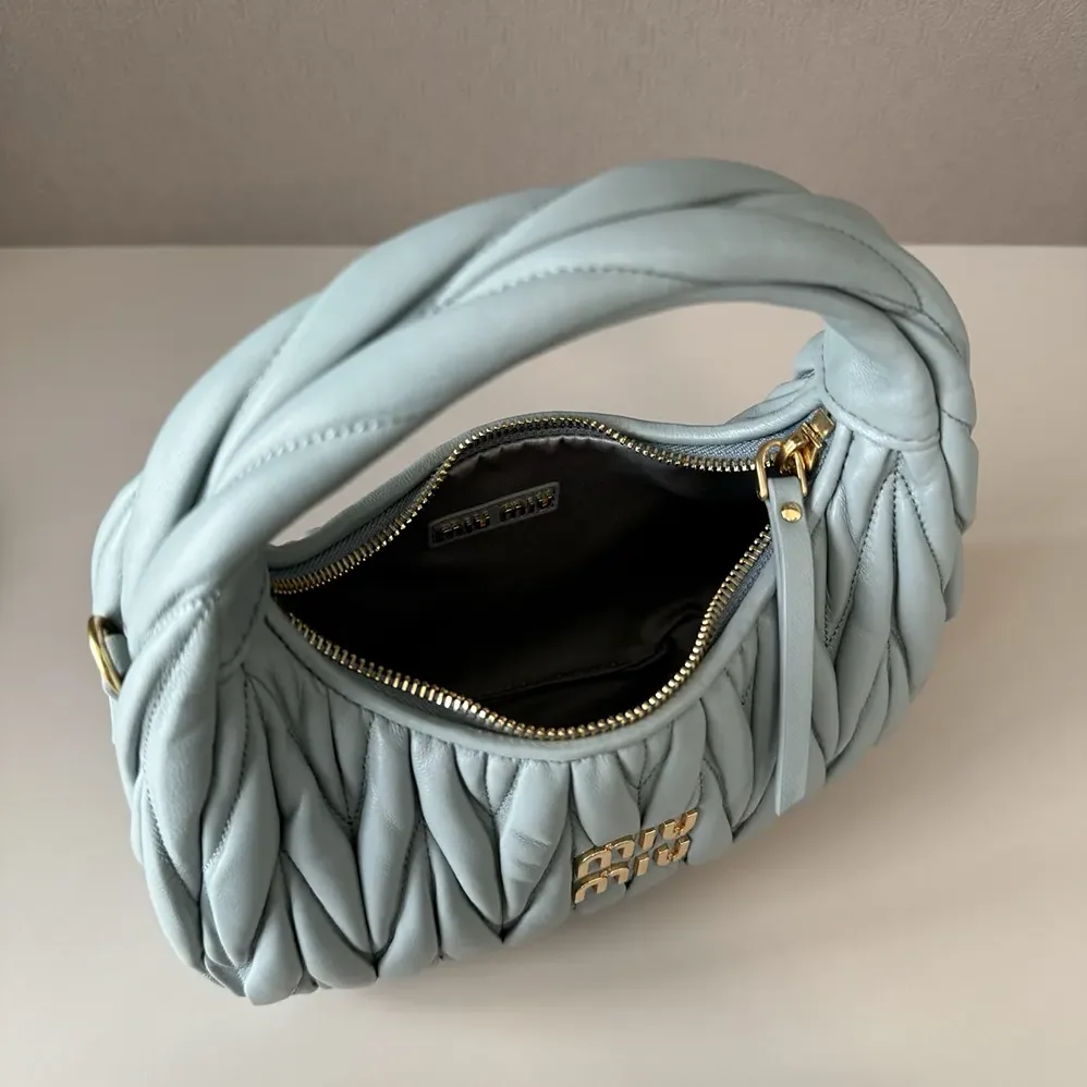 Miu Miu Wander Matelassé Nappa Leather Hobo Bag for Women in Powder Blue Miu Miu Wander Matelassé Nappa Leather Hobo Bag for Women in Powder Blue