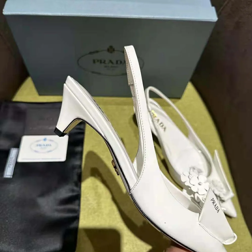 Prada Brushed Leather Slingback Pumps with Floral Appliques for Women in White Prada Brushed Leather Slingback Pumps with Floral Appliques for Women in White