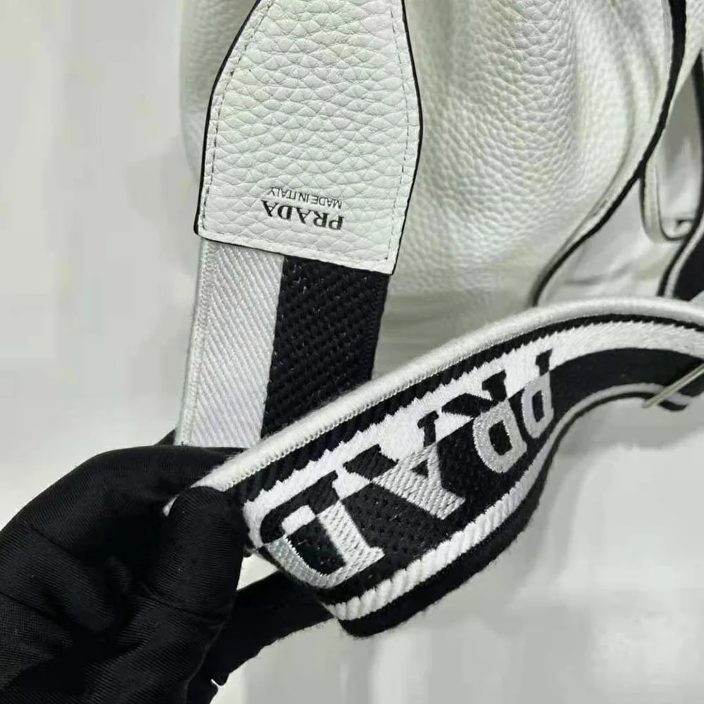 Prada Leather Bucket Bag with A Soft Silhouette for Women in White Prada Leather Bucket Bag with A Soft Silhouette for Women in White