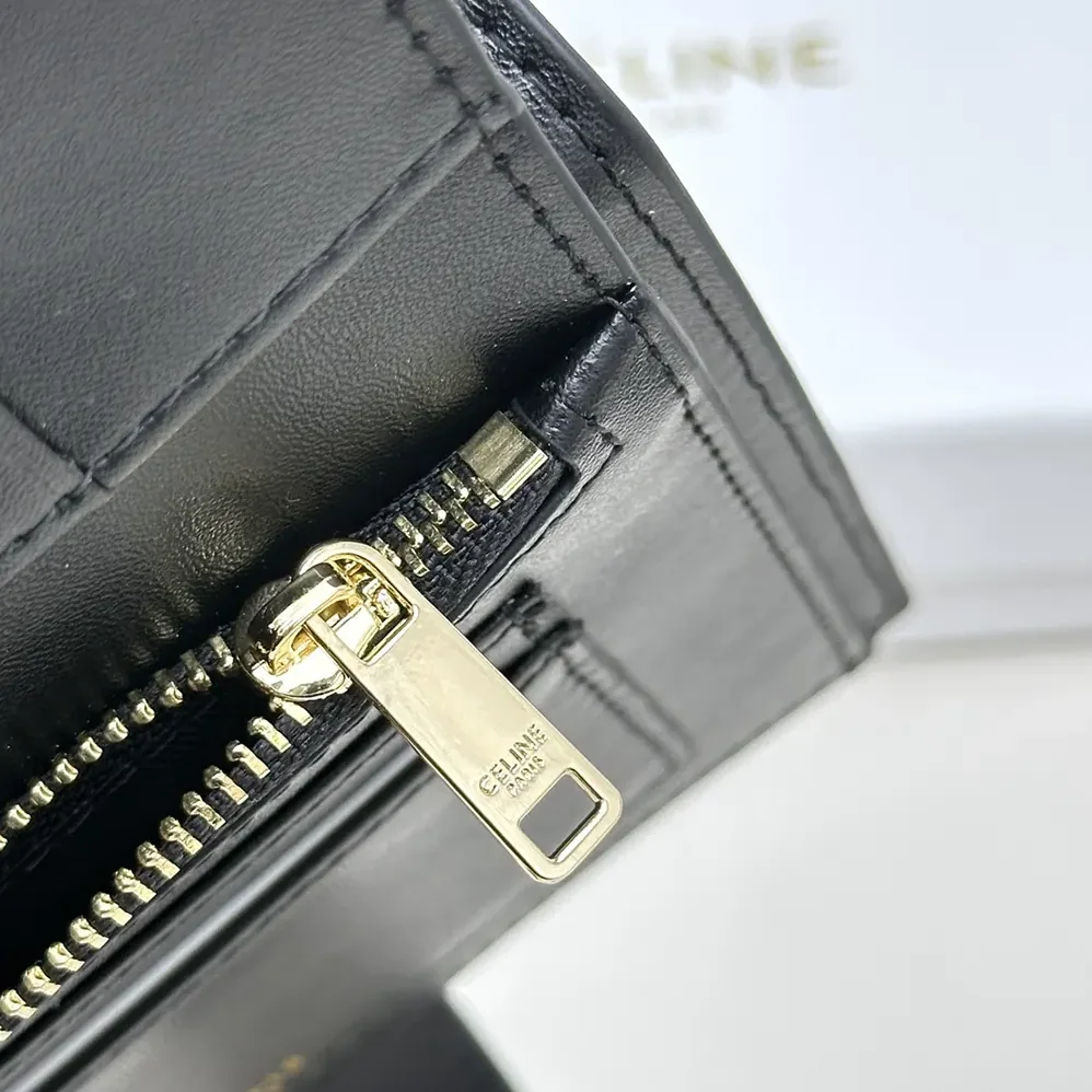 Celine Medium Strap Wallet Nino in Supple Grained Calfskin for Women in Black Celine Medium Strap Wallet Nino in Supple Grained Calfskin for Women in Black