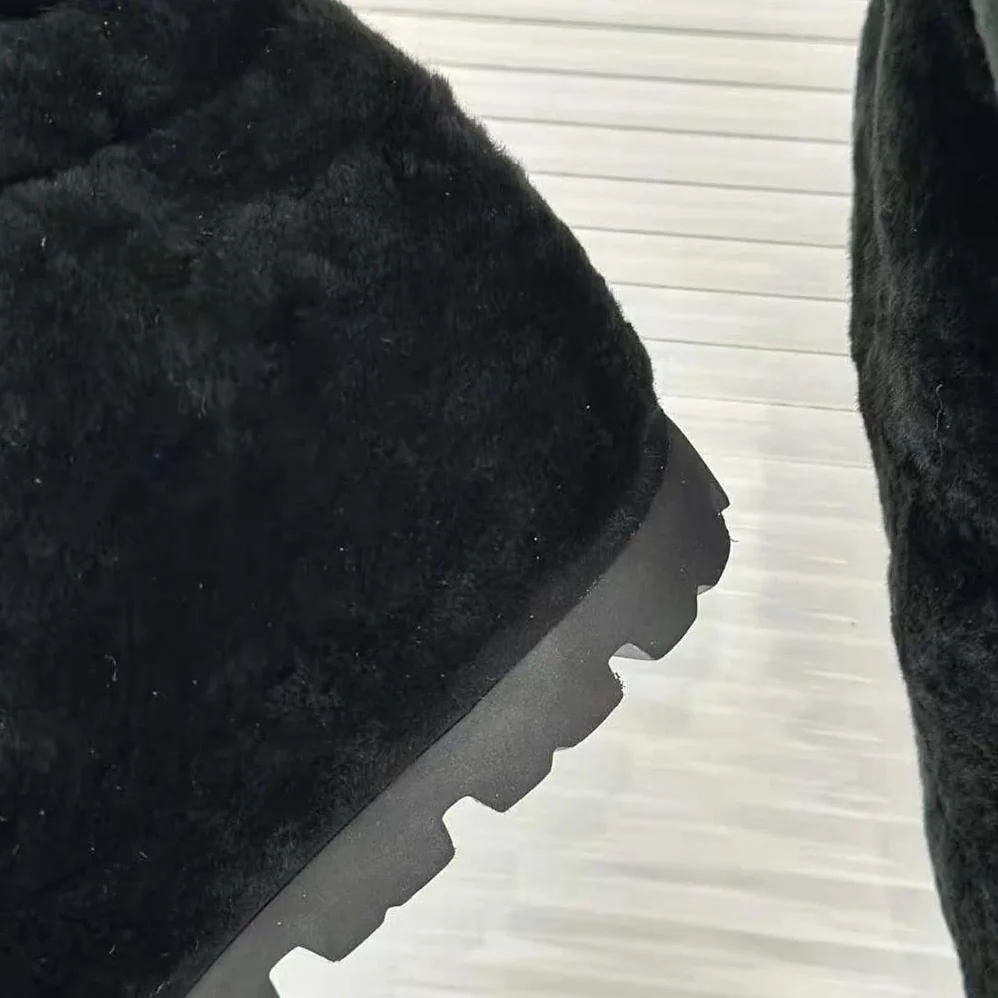 Prada Shearling Booties with Enameled Metal Triangle Logo for Women in Black