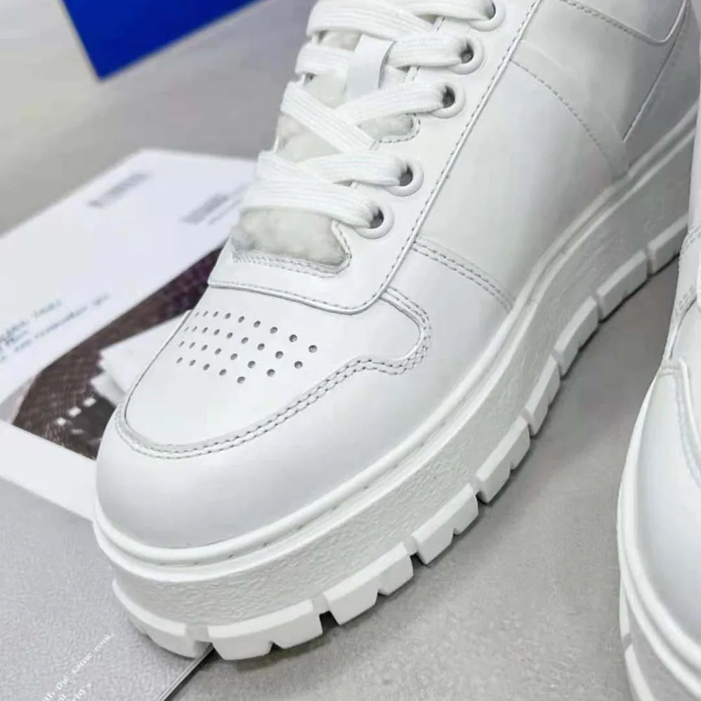 Prada Leather and Shearling Sneakers for Women in White