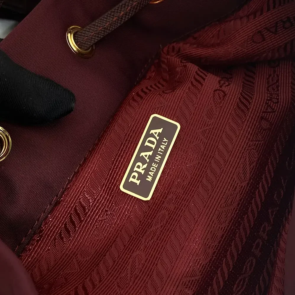 Prada Duet Re-Nylon Bucket Bag for Women in Maroon Prada Duet Re-Nylon Bucket Bag for Women in Maroon