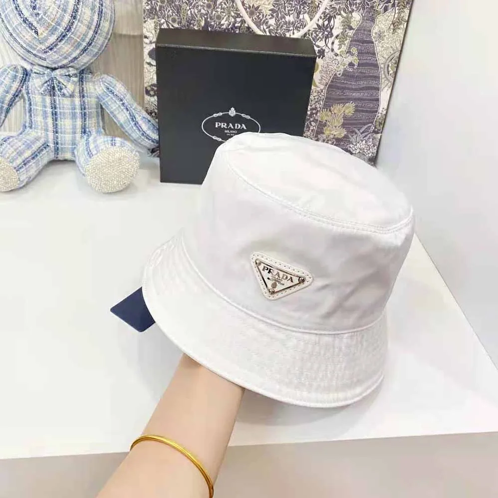 Prada Nylon Bucket Hat Decorated with the Triangle Logo for Women in White Prada Nylon Bucket Hat Decorated with the Triangle Logo for Women in White