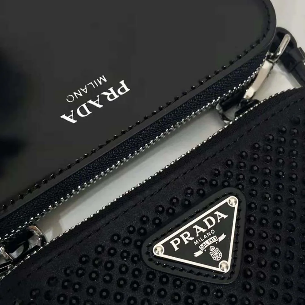 Prada Triangular Embellished Satin and Leather Mini-pouch for Women in Black Prada Triangular Embellished Satin and Leather Mini-pouch for Women in Black