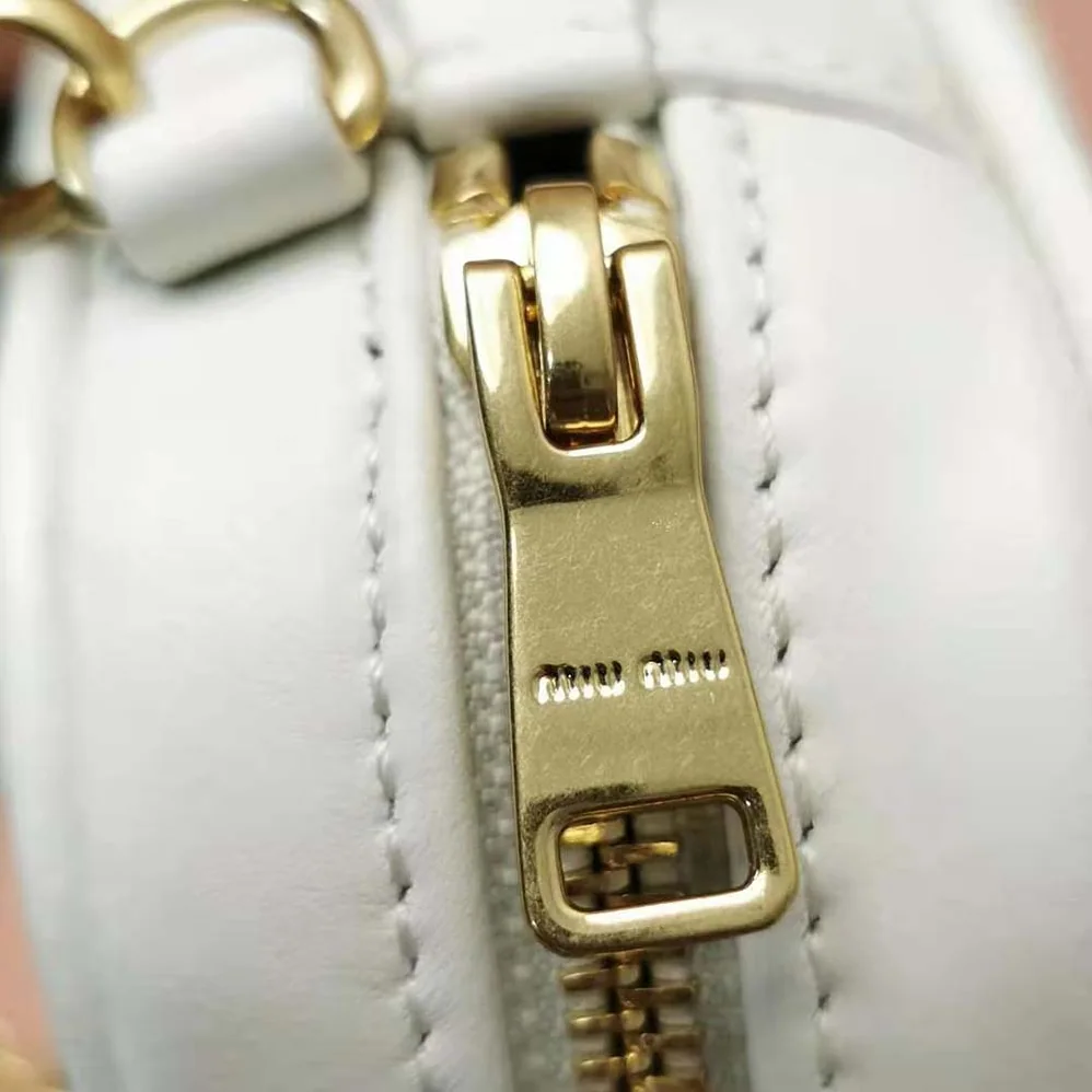 Miu Miu Matelassé Nappa Leather Top-Handle Mini-Bag for Women in White Miu Miu Matelassé Nappa Leather Top-Handle Mini-Bag for Women in White