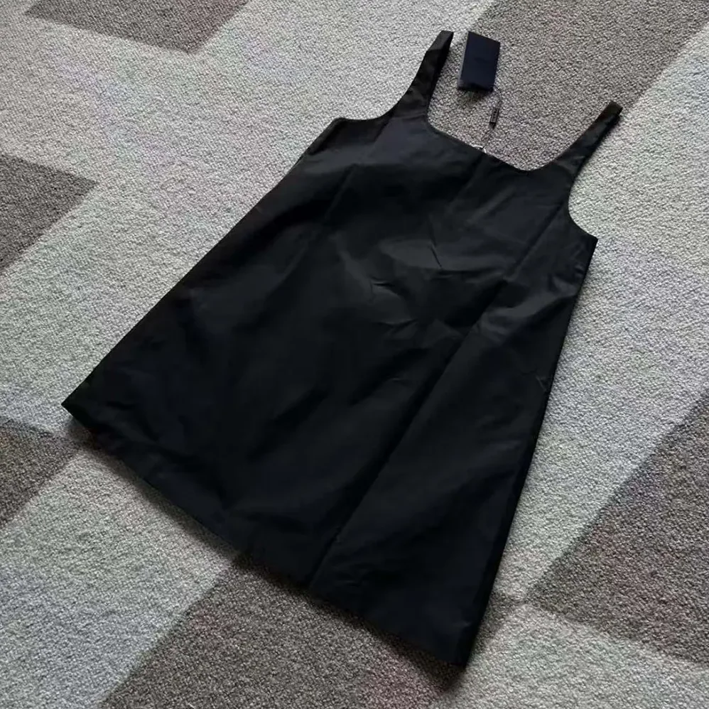 Prada Re-Nylon Mini-dress with Metal Triangle Logo for Women in Black Prada Re-Nylon Mini-dress with Metal Triangle Logo for Women in Black