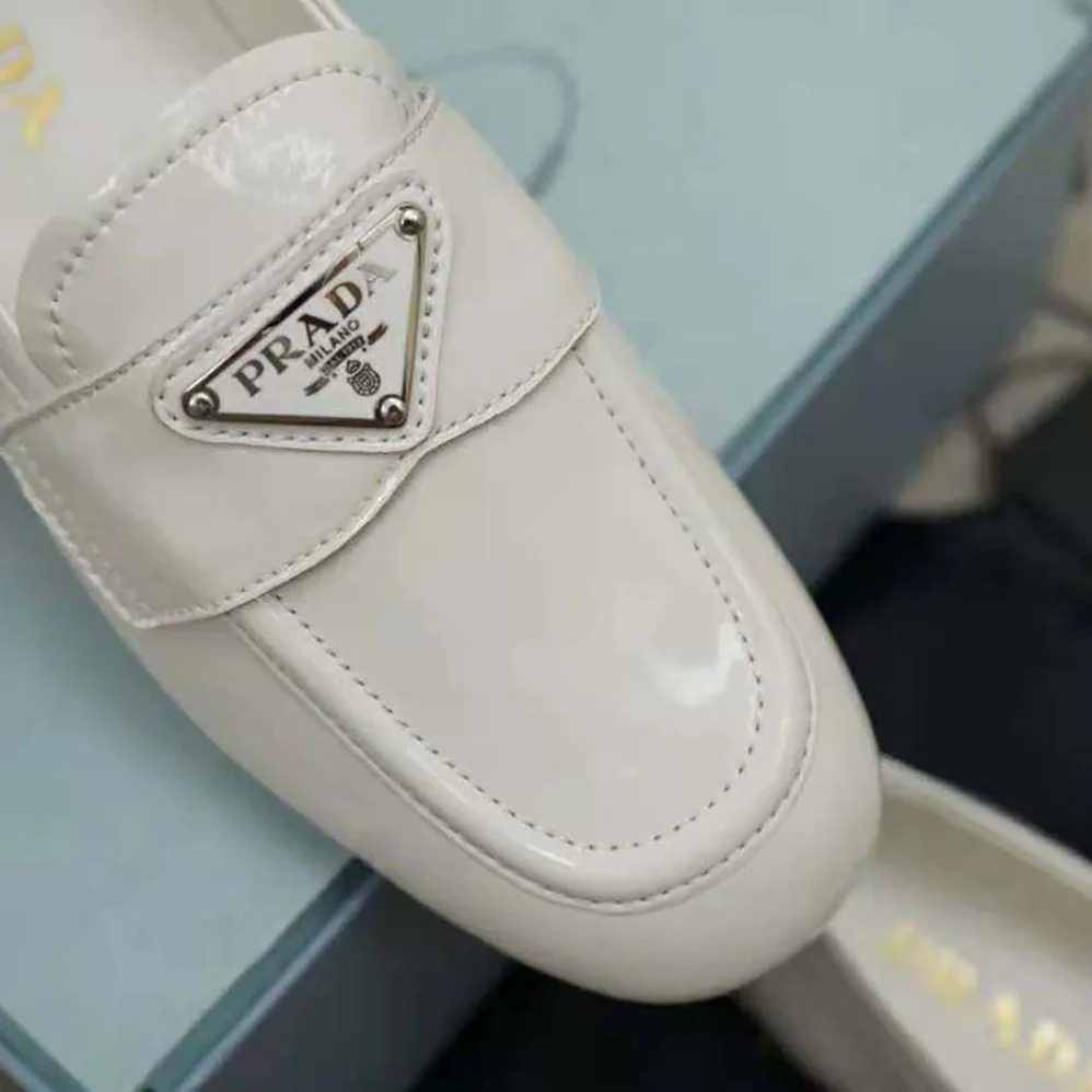 Prada Patent Leather Loafers in 5mm Heel for Women in White Prada Patent Leather Loafers in 5mm Heel for Women in White