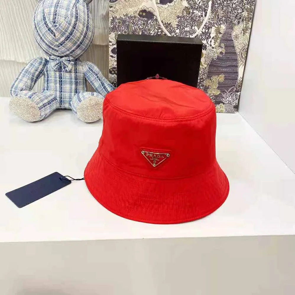 Prada Nylon Bucket Hat Decorated with the Triangle Logo for Women in Red