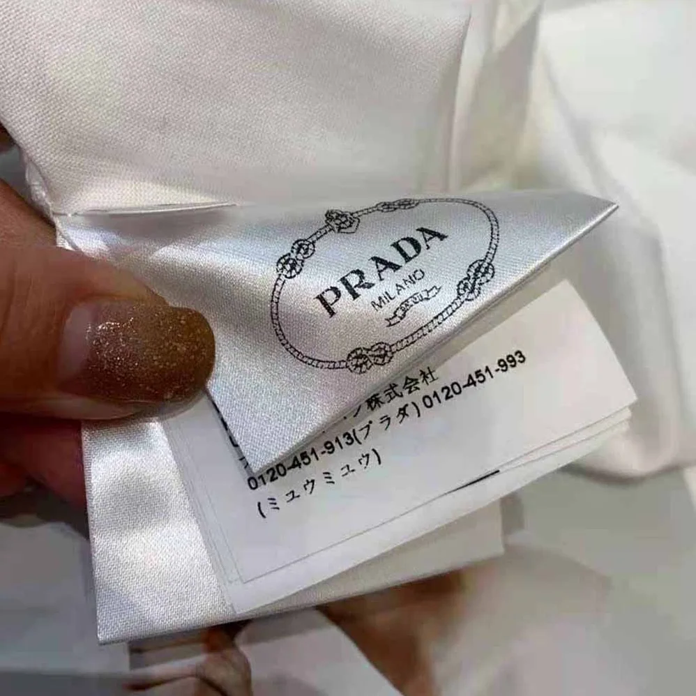 Prada Printed Cotton T-shirt with the Lettering Logo for Women in White Prada Printed Cotton T-shirt with the Lettering Logo for Women in White