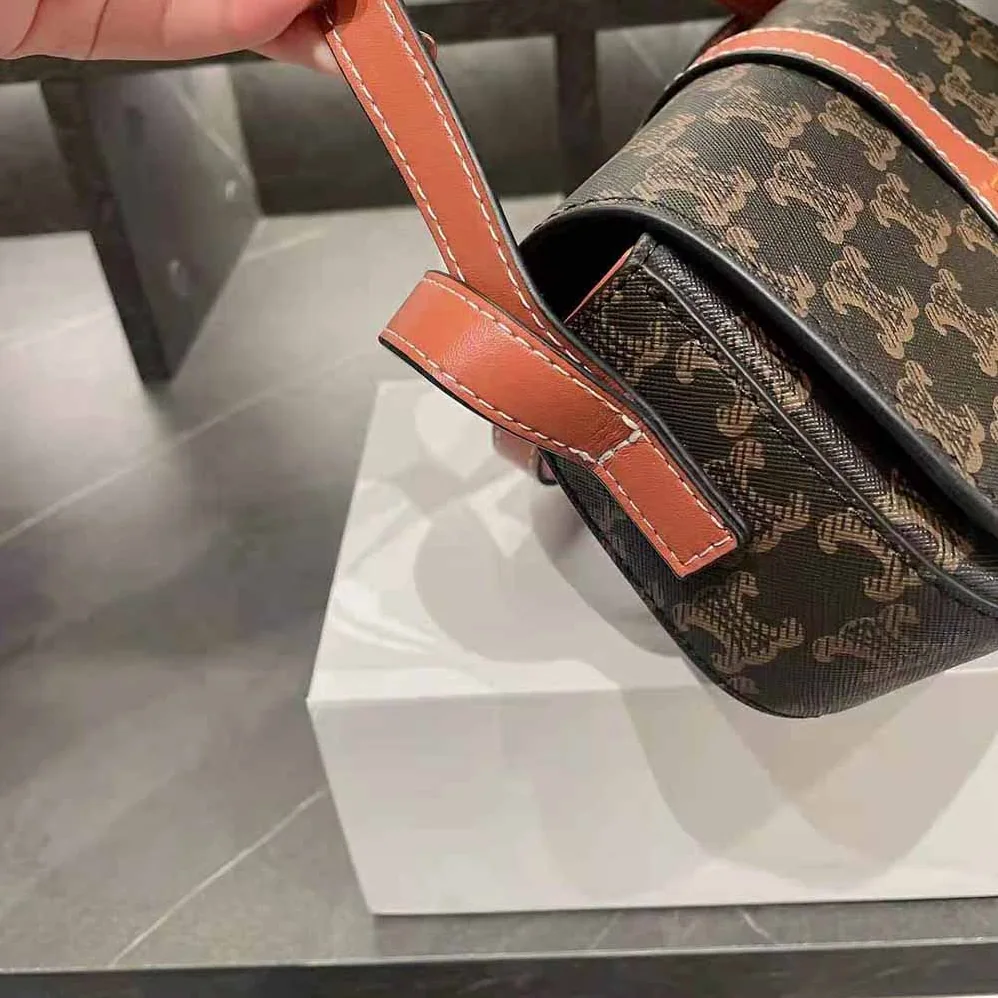 Celine Clutch on Strap in Triomphe Canvas and Calfskin for Women