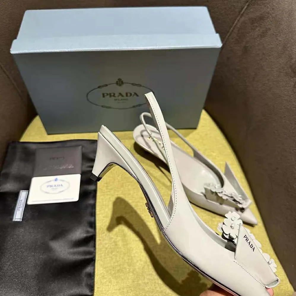 Prada Brushed Leather Slingback Pumps with Floral Appliques for Women in Gray Prada Brushed Leather Slingback Pumps with Floral Appliques for Women in Gray