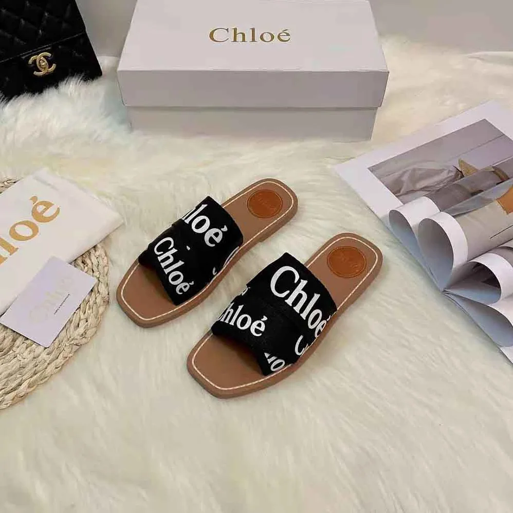 Chloe Woody Flat Mule in Canvas for Women in Black Chloe Woody Flat Mule in Canvas for Women in Black
