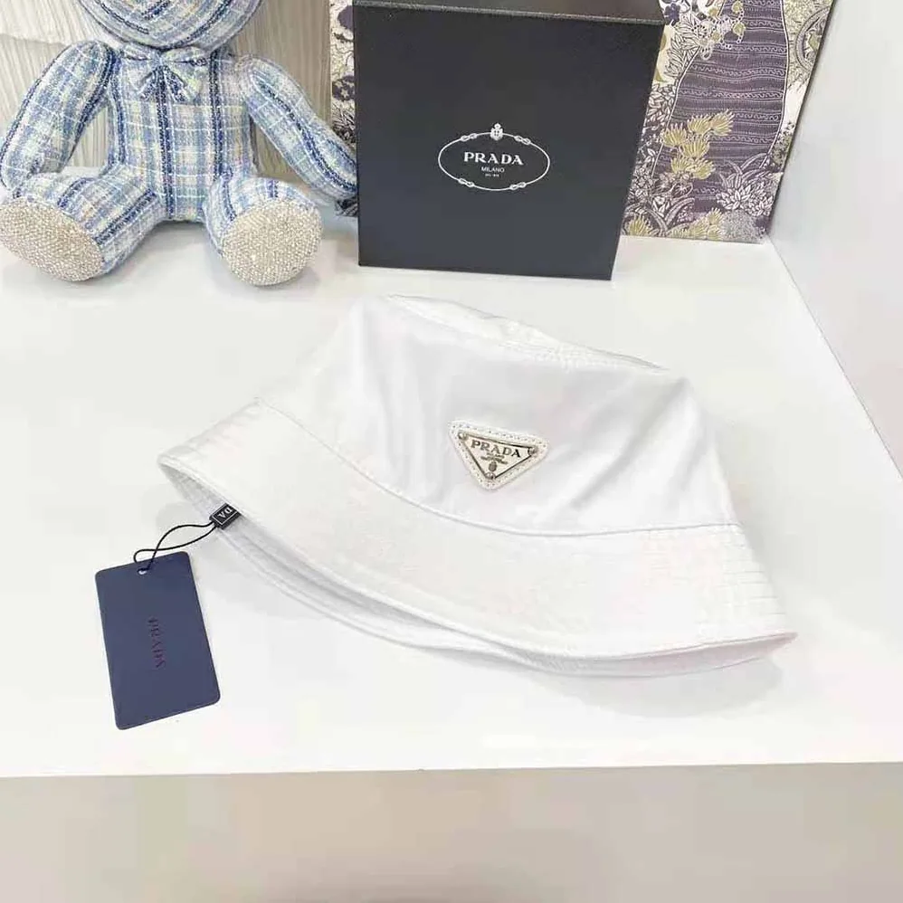 Prada Nylon Bucket Hat Decorated with the Triangle Logo for Women in White Prada Nylon Bucket Hat Decorated with the Triangle Logo for Women in White