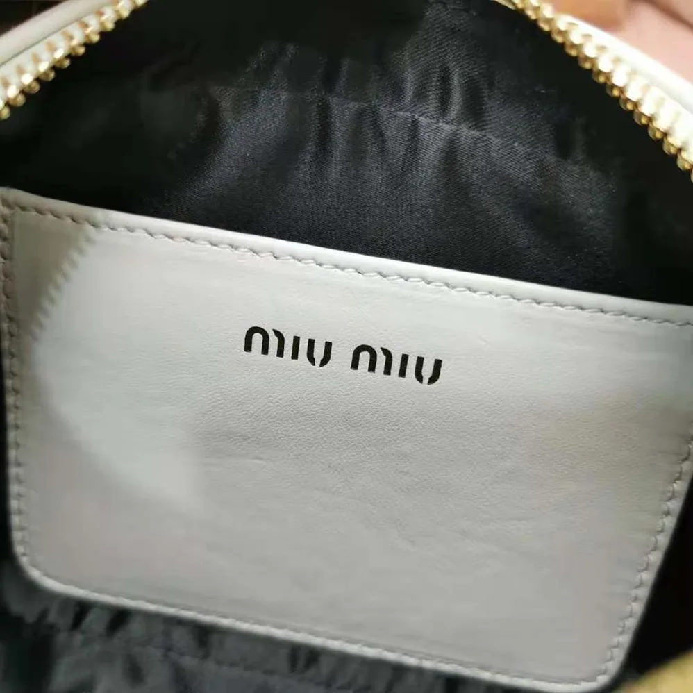 Miu Miu Matelassé Nappa Leather Top-Handle Mini-Bag for Women in White Miu Miu Matelassé Nappa Leather Top-Handle Mini-Bag for Women in White