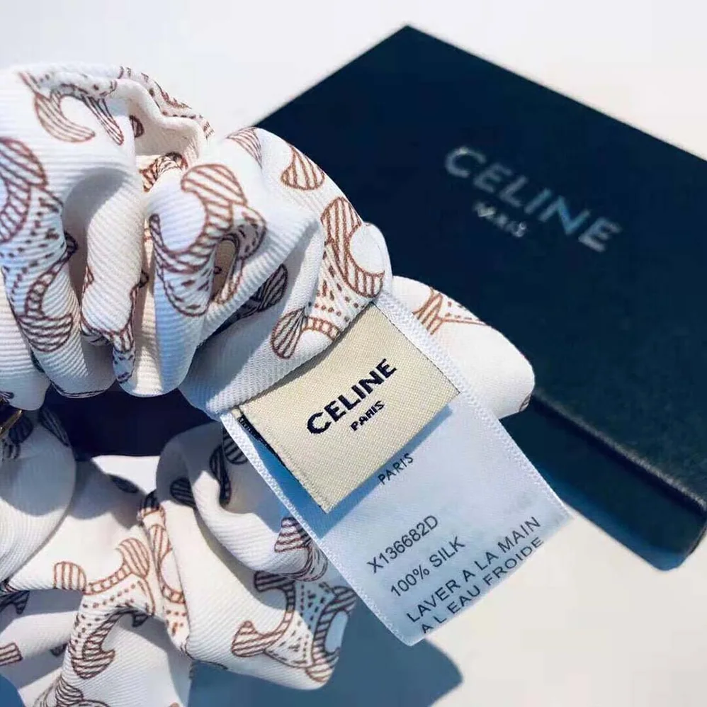 Celine Scrunchy Celine Triomphe Monogram Bracelet in Brass with Gold Finish and White Silk for Women Celine Scrunchy Celine Triomphe Monogram Bracelet in Brass with Gold Finish and White Silk for Women