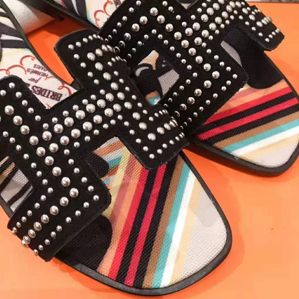 Hermes Oran Sandal in Suede Goatskin with Palladium Plated Studs and Iconic “H” Cut-Out for Women in Black