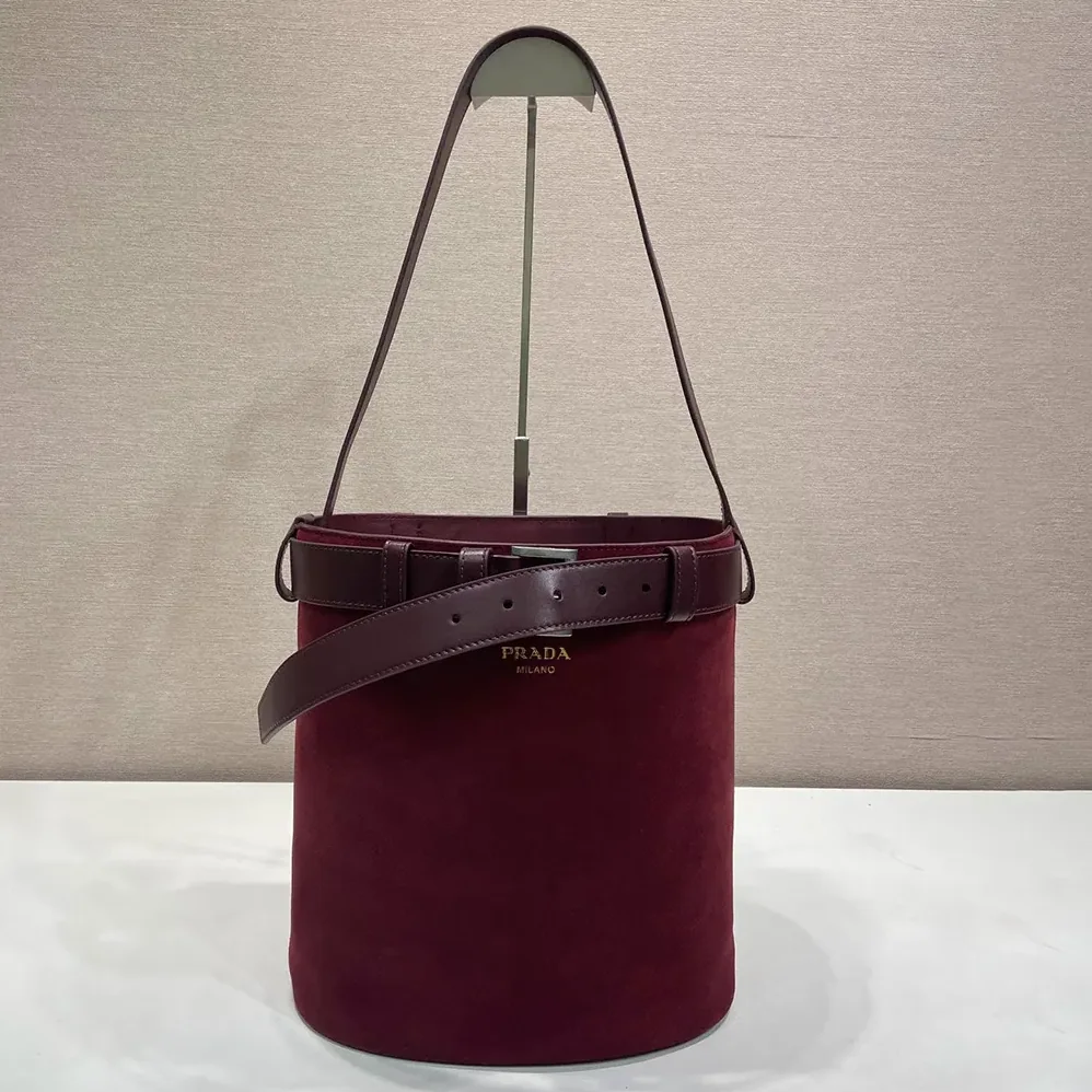 Prada Buckle Belted Suede Bucket Bag for Women in Burgundy Prada Buckle Belted Suede Bucket Bag for Women in Burgundy