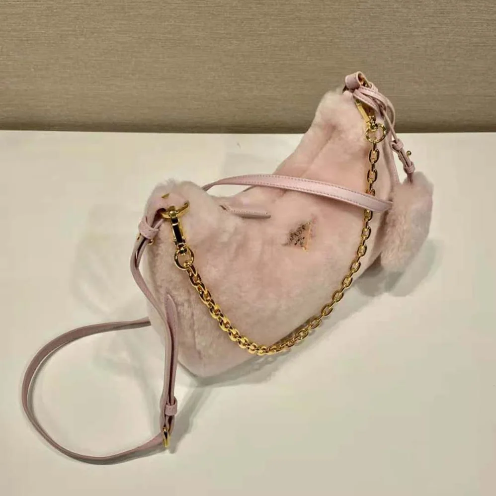 Prada Shearling Mini-Bag with the Enameled Metal Triangle Logo for Women in Pink Prada Shearling Mini-Bag with the Enameled Metal Triangle Logo for Women in Pink