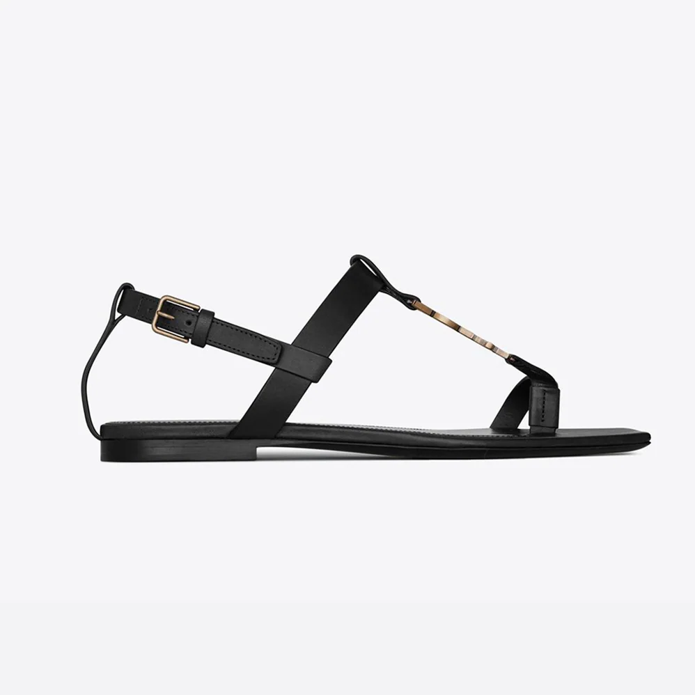 Saint Laurent YSL Cassandra Flat Sandals in Smooth Leather with Gold-tone Monogram for Women in Black