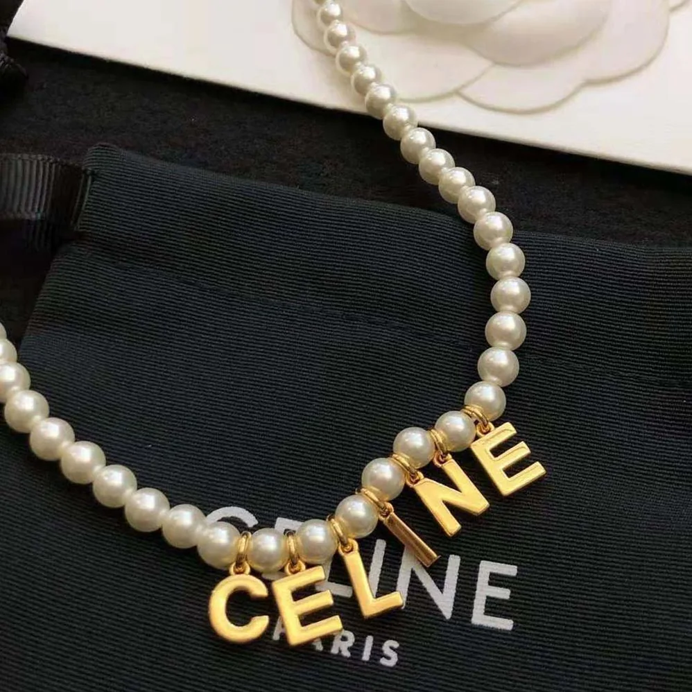 Celine Paris Pearl Bracelet in Brass with Gold Finish and Glass Pearls for Women Celine Paris Pearl Bracelet in Brass with Gold Finish and Glass Pearls for Women