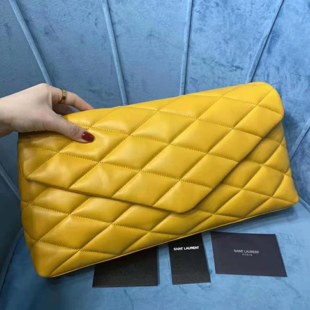 Saint Laurent YSL Sade Puffer Envelope Clutch in Lambskin for Women in Yellow Saint Laurent YSL Sade Puffer Envelope Clutch in Lambskin for Women in Yellow