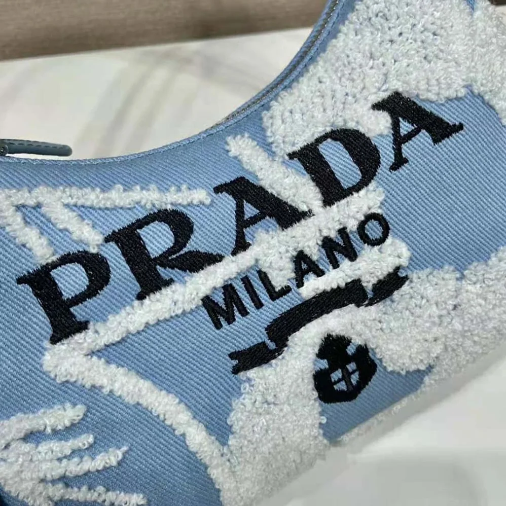 Prada Re-Edition 2000 Embroidered Drill Mini Bag for Women in Blue
