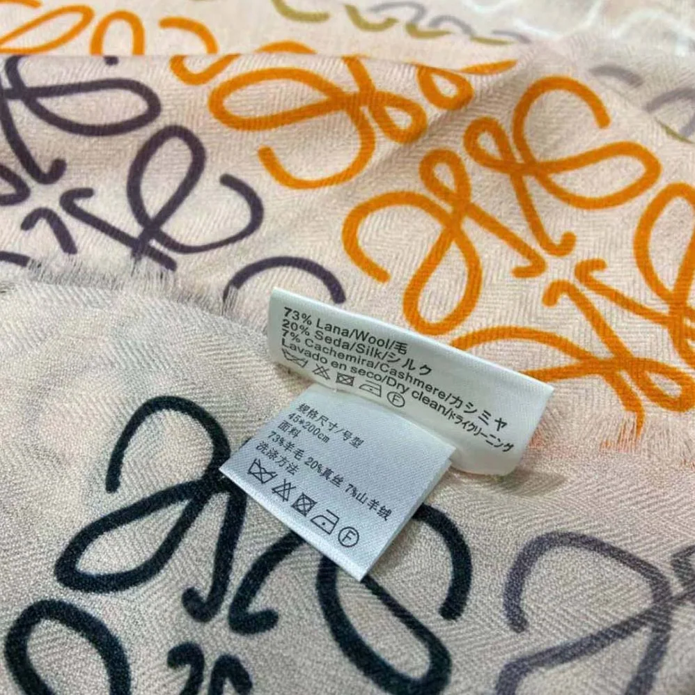 Loewe Anagram Lines Scarf in Wool and Cashmere for Women in White Loewe Anagram Lines Scarf in Wool and Cashmere for Women in White