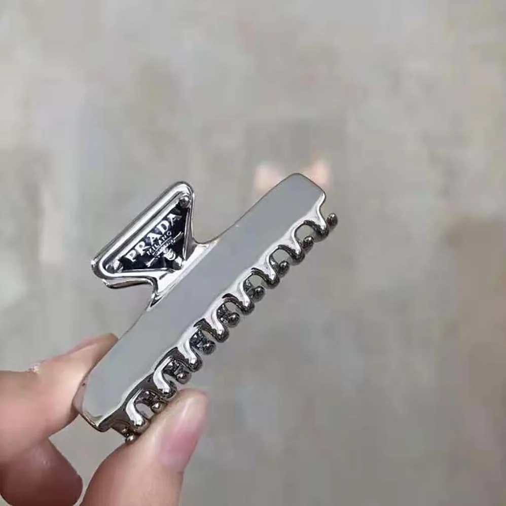 Prada Metal Hair Clip with Sophisticated and Versatile Allure for Women Prada Metal Hair Clip with Sophisticated and Versatile Allure for Women
